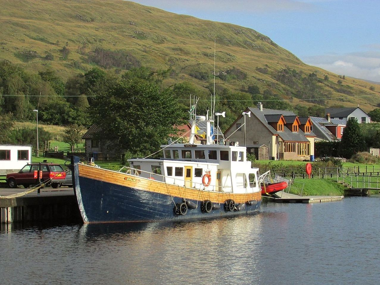 Classic wooden rowboat with oars resting on the gunwale